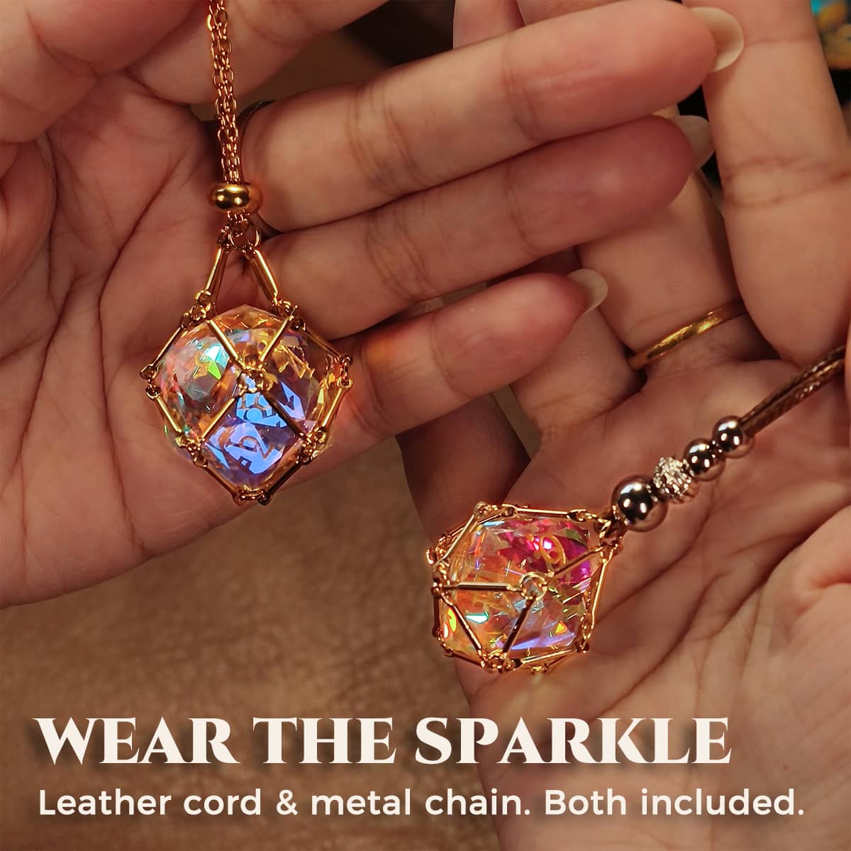 Two rainbow-reflective die pendants on a metal chain and brown leather cord.