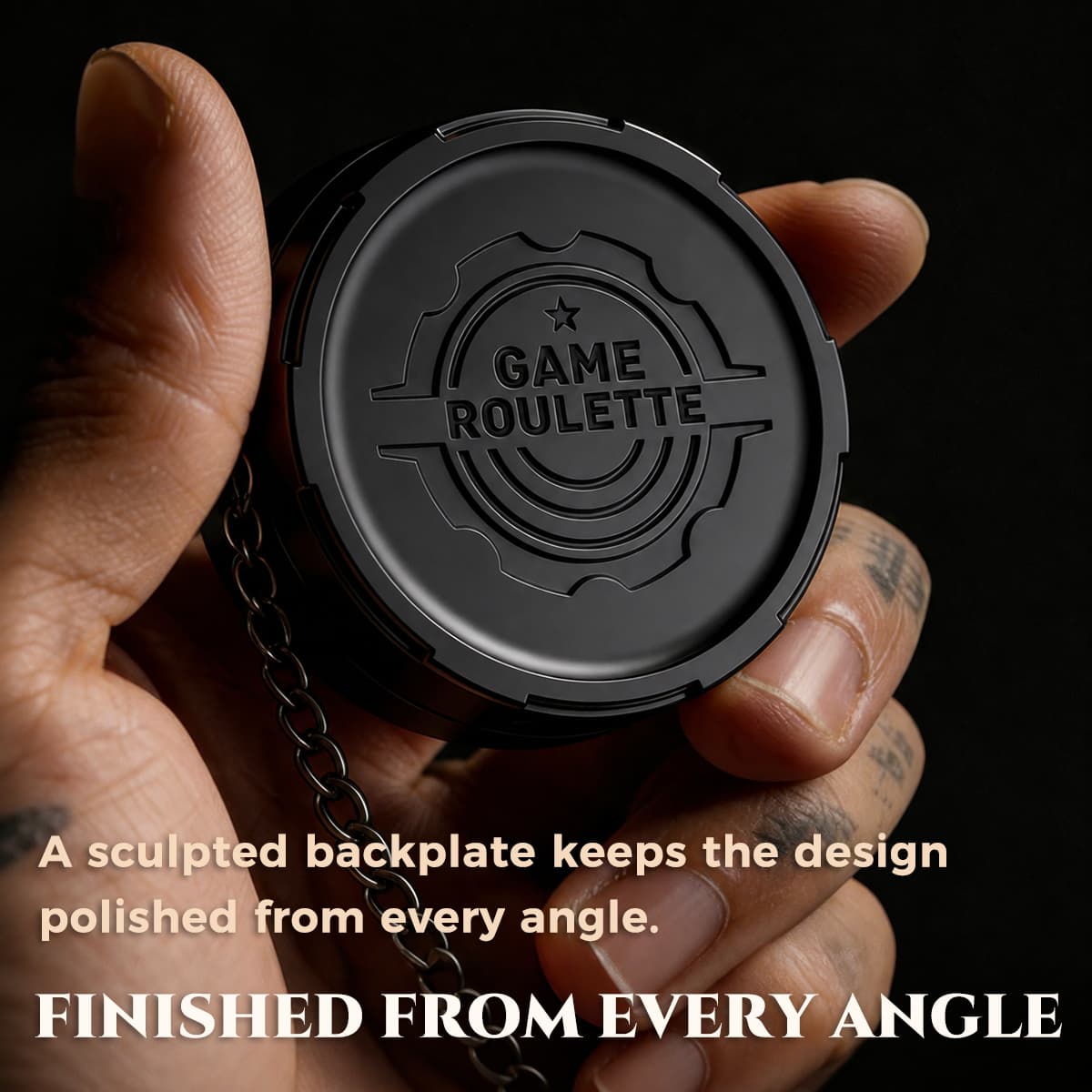 Back view of the black metal D20 decision spinner showing its sculpted game roulette plate.