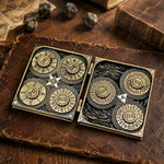 Open antique bronze 7-in-1 dice codex with seven numbered RPG spinner dials.