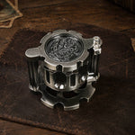 Antique silver reloadable dice cylinder shown at an angle with dragon medallion top.