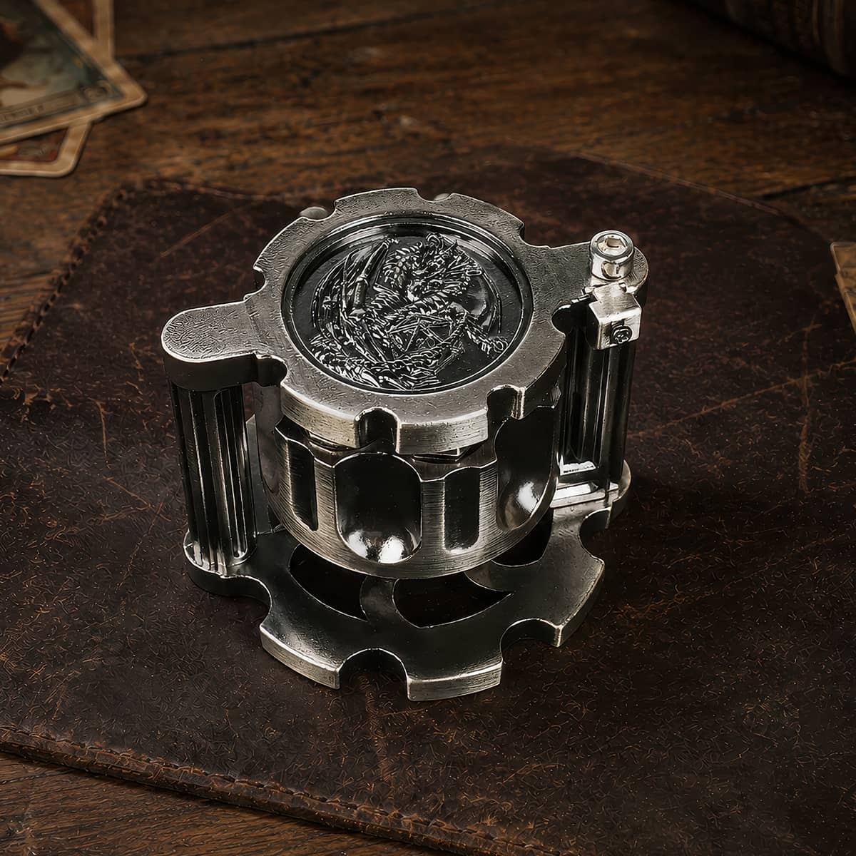 Antique silver reloadable dice cylinder shown at an angle with dragon medallion top.