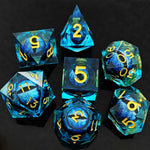 Blue moving dragon eye polyhedral dice set with gold numbers on a black background.