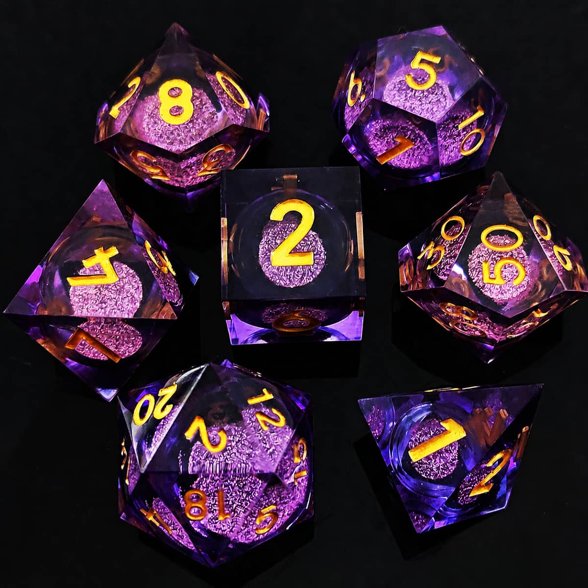 Amethyst liquid-core RPG dice set with purple glitter and yellow numbers on black.